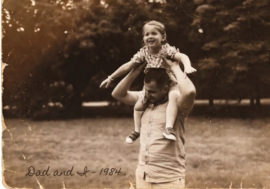 A vintage sepia photograph of a father carrying his young daughter on his shoulders in a park, handwritten 'My dad and I 1984'